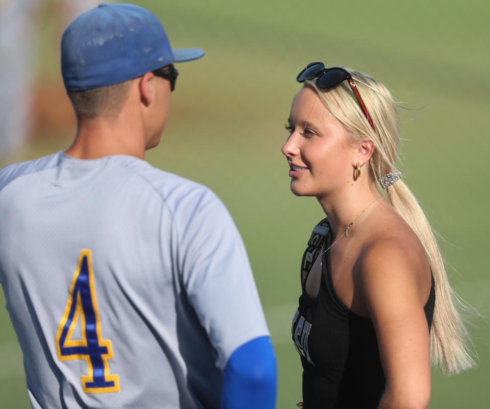 Angelo State University second baseman Austin Beck talks with his girlfriend after the Rams finished off Texas A&M-Kingsville at the South Central Regional at Foster Field at 1st Community Credit Union Stadium on Saturday, May 21, 2022.