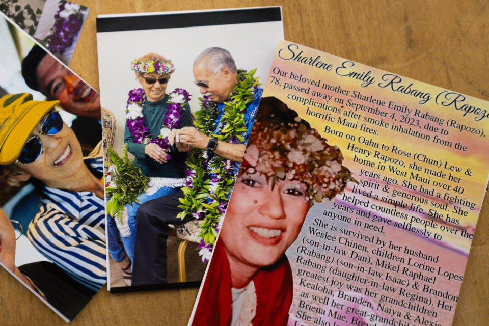 Photos of Sharlene Rabang, who was named as the 100th victim of the Lahaina wildfires after dying weeks after fleeing her home, Tuesday, Dec. 5, 2023, are seen at her husband Weslee Chinen's family home in Waipahu, Hawaii. Honolulu's medical examiner said a contributing cause of her death was the thick, black smoke that Rabang breathed as she fled. The report made Rabang the 100th victim of the deadliest U.S. wildfire in more than a century. (AP Photo/Lindsey Wasson)