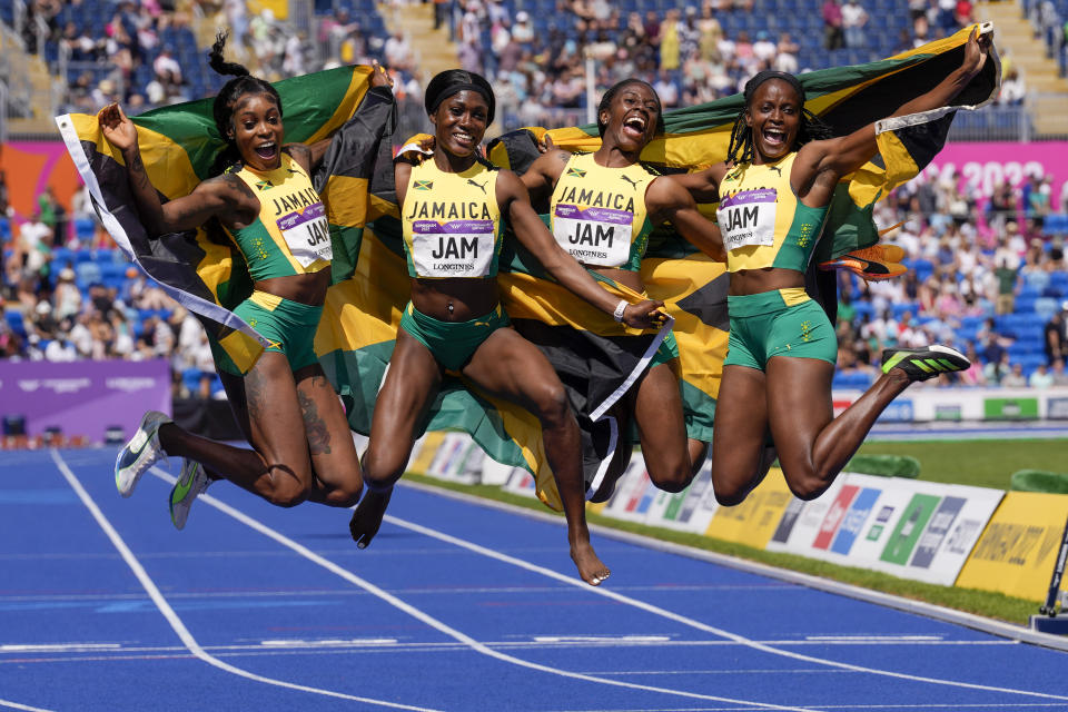 Jamaica's women's 4 x 100 meters relay final team celebrate their bronze medal during the athletics in the Alexander Stadium at the Commonwealth Games in Birmingham, England, Sunday, Aug. 7, 2022. (AP Photo/Manish Swarup)