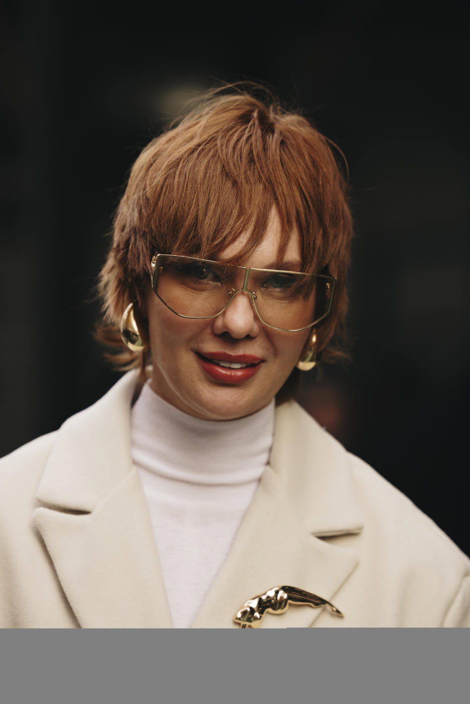 Woman wearing a brooch at New York RTW Fashion Week.