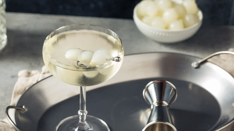 A Gibson martini on a silver platter