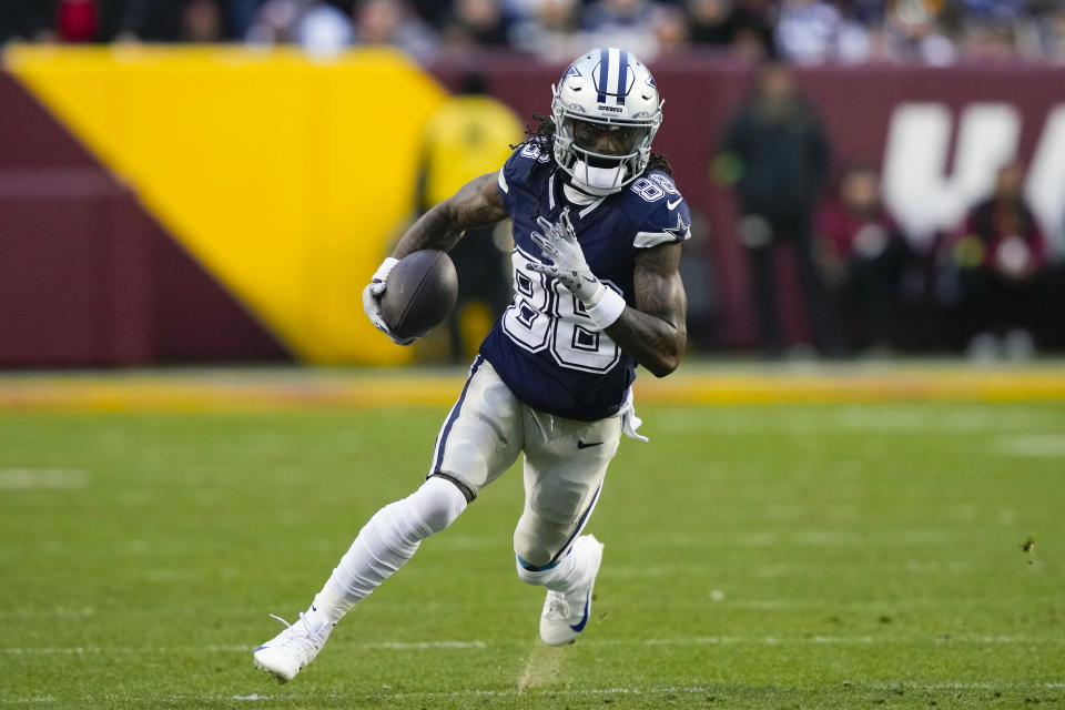 FILE - Dallas Cowboys wide receiver CeeDee Lamb (88) runs with the ball against the Washington Commanders during the first half of an NFL football game, Sunday, Jan. 7, 2024, in Landover, Md. CeeDee Lamb is a finalist for The Associated Press 2023 Offensive Player of the Year.(AP Photo/Susan Walsh, File)