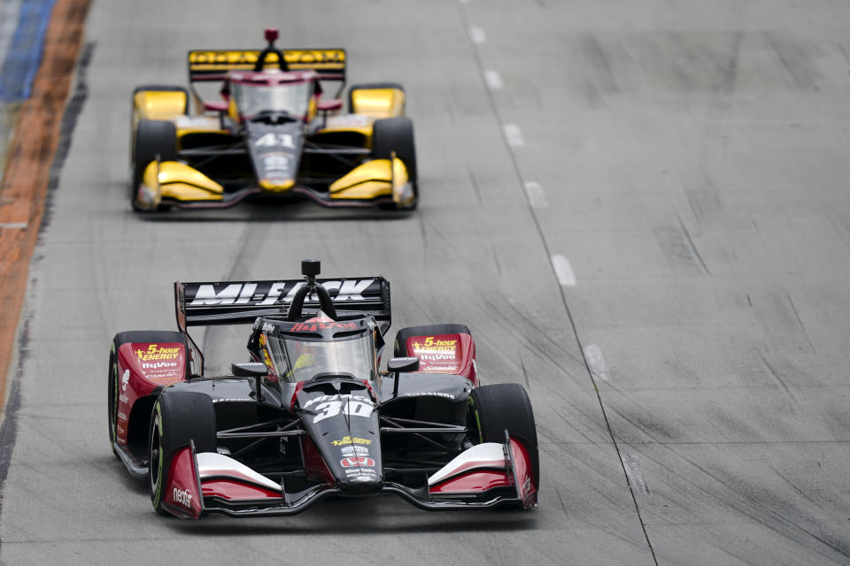 Rahal Letterman Lanigan Racing driver Pietro Fittipaldi, front, runs laps in front of A. J. Foyt Enterprises driver Sting Ray Robb during a qualifying session for the IndyCar Grand Prix of Long Beach auto race Saturday, April 20, 2024, in Long Beach, Calif. (AP Photo/Ryan Sun)