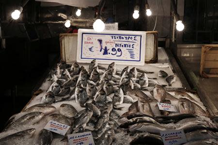 Sea bream are on sale at a market stall inside a fish market of Athens November 20, 2013. REUTERS/Yorgos Karahalis