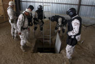 Soldier prepare a ladder to enter a tunnel during a presentation to the media in Tijuana November 16, 2011. REUTERS/Jorge Duenes