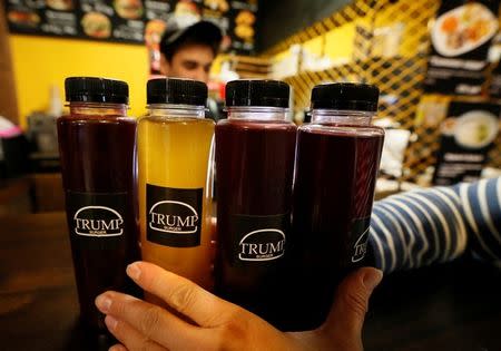 A visitor takes berry juice at Trump Burger, a new Russian diner named after U.S. President Donald Trump, in Krasnoyarsk, Russia July 17, 2018. Picture taken July 17, 2018. REUTERS/Ilya Naymushin