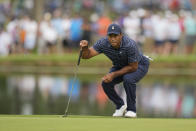 Tiger Woods lines up a putt on the 11th hole during the first round of the PGA Championship golf tournament, Thursday, May 19, 2022, in Tulsa, Okla. (AP Photo/Eric Gay)