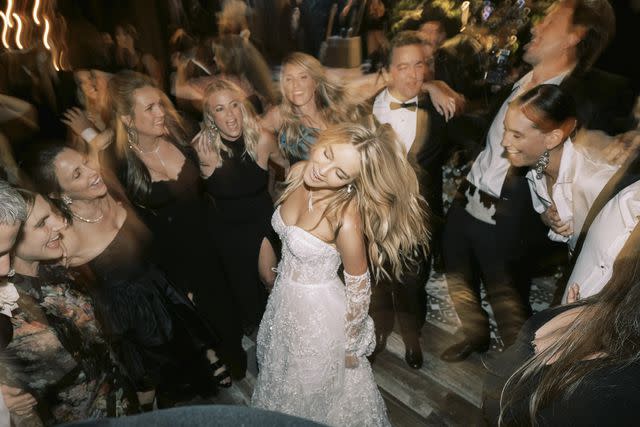 <p>The Brothers Martens</p> Hassie Harrison celebrating on her wedding day