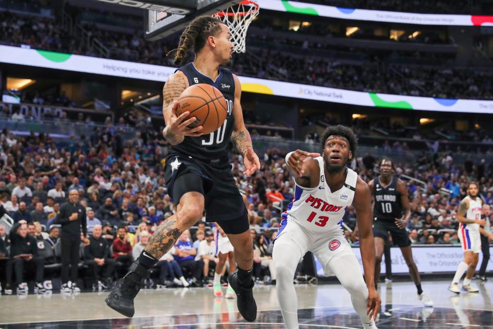 Magic guard Cole Anthony looks to pass against Pistons center James Wiseman during the second quarter on Thursday, Feb. 23, 2023, in Orlando, Florida.