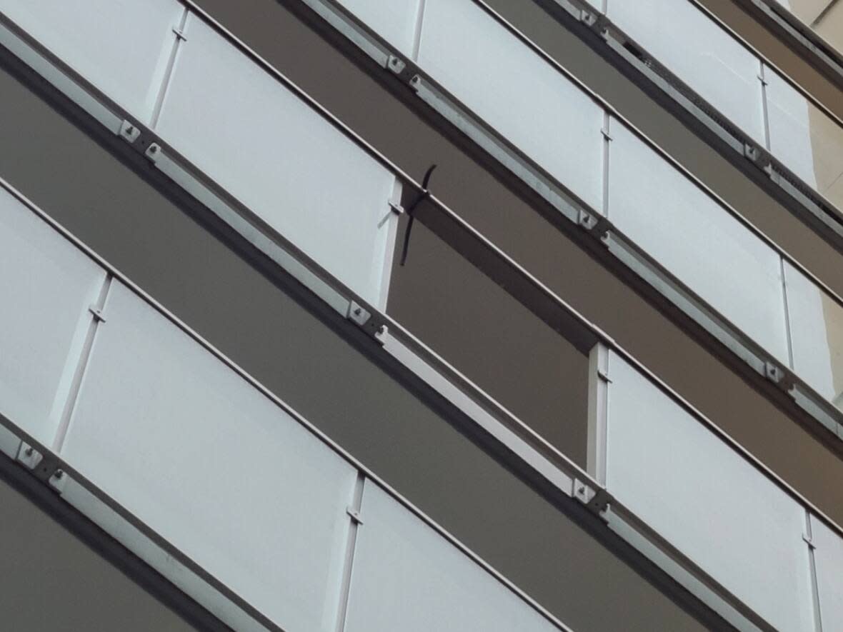 A glass panel was missing from a ninth-floor unit at 1471 Hunter St. in North Vancouver after it shattered and fell on the patios below on February 6, 2023. (Matt Smith - image credit)