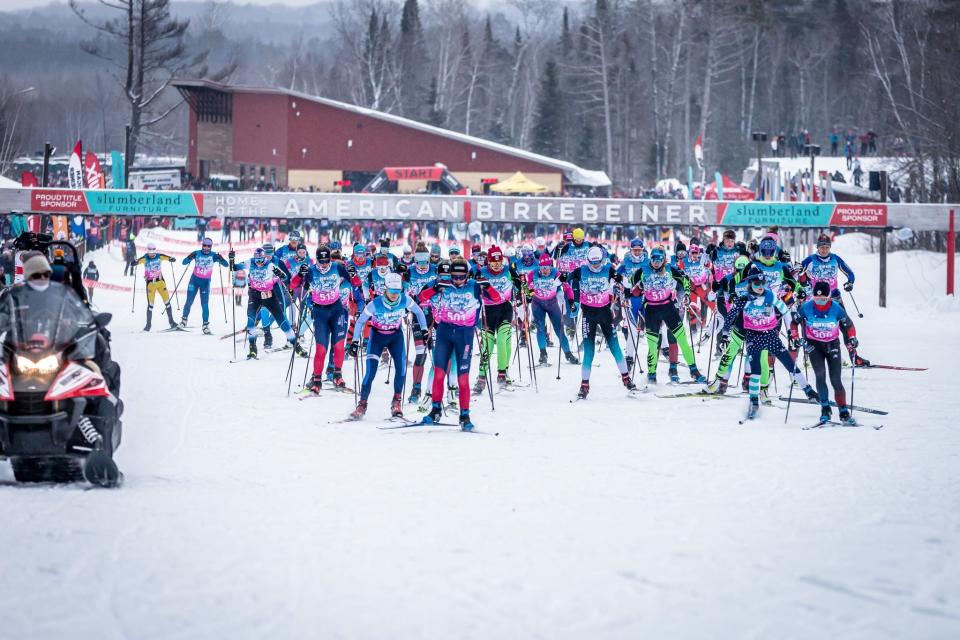 Competitors in the freestyle style race take off during the 49th American Birkebeiner cross country ski marathon from Cable to Hayward, Wisconsin, on Saturday, February 25, 2023.