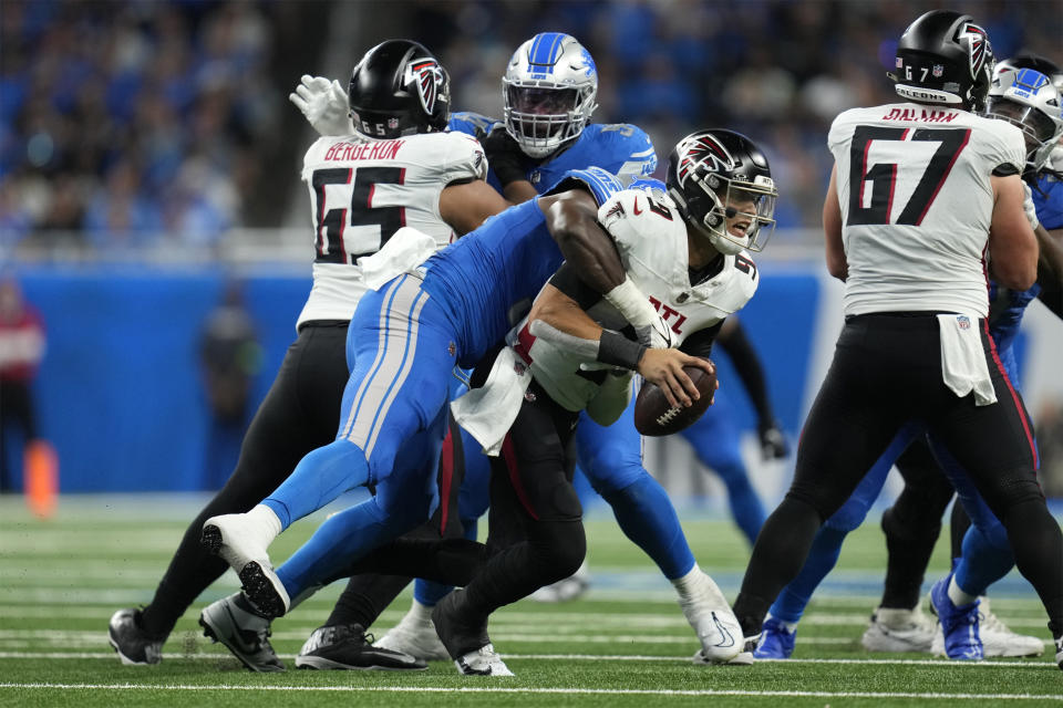 Detroit Lions defensive end Charles Harris, front left, sacks Atlanta Falcons quarterback Desmond Ridder (9) in the second half of an NFL football game Sunday, Sept. 24, 2023, in Detroit. (AP Photo/Paul Sancya)