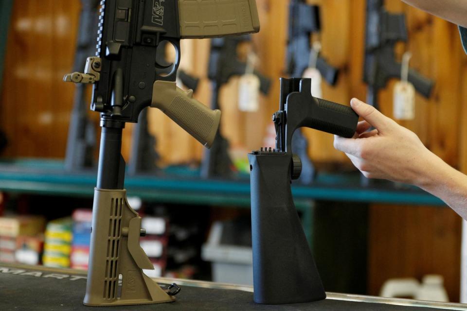 A bump fire stock, (R), that attaches to a semi-automatic rifle to increase the firing rate is seen at Good Guys Gun Shop in Orem, Utah, U.S., October 4, 2017 (REUTERS)