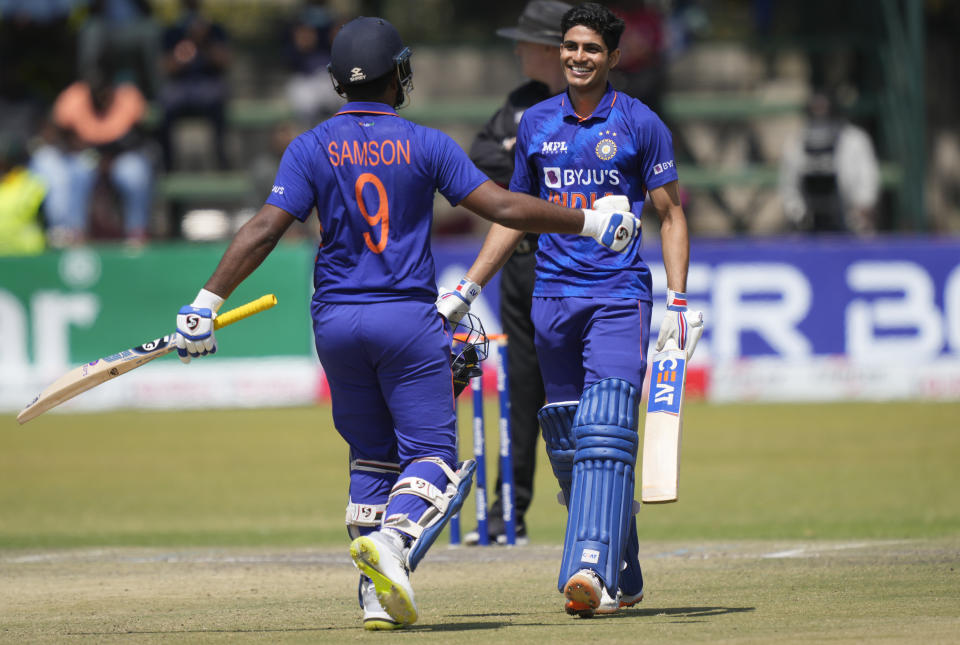 Indian batsman Shubman Gill celebrates after scoring 100 runs on the last day of the One-Day International cricket match between Zimbabwe and India at Harare Sports Club in Harare, Zimbabwe, Monday, Aug, 22, 2022. (AP Photo/Tsvangirayi Mukwazhi)