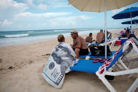 Tourists relax at Santa Maria beach in the outskirts of Havana