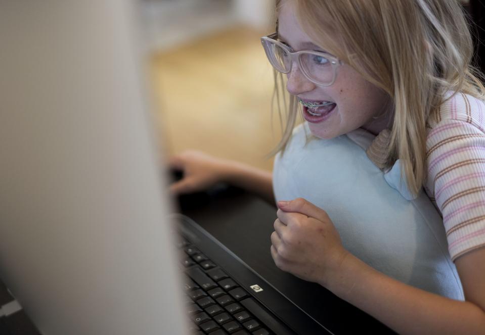 Millie Tripp, 9, reacts to receiving a good grade on her math work at her home in Cedar Hills on Wednesday, Aug. 30, 2023. | Laura Seitz, Deseret News