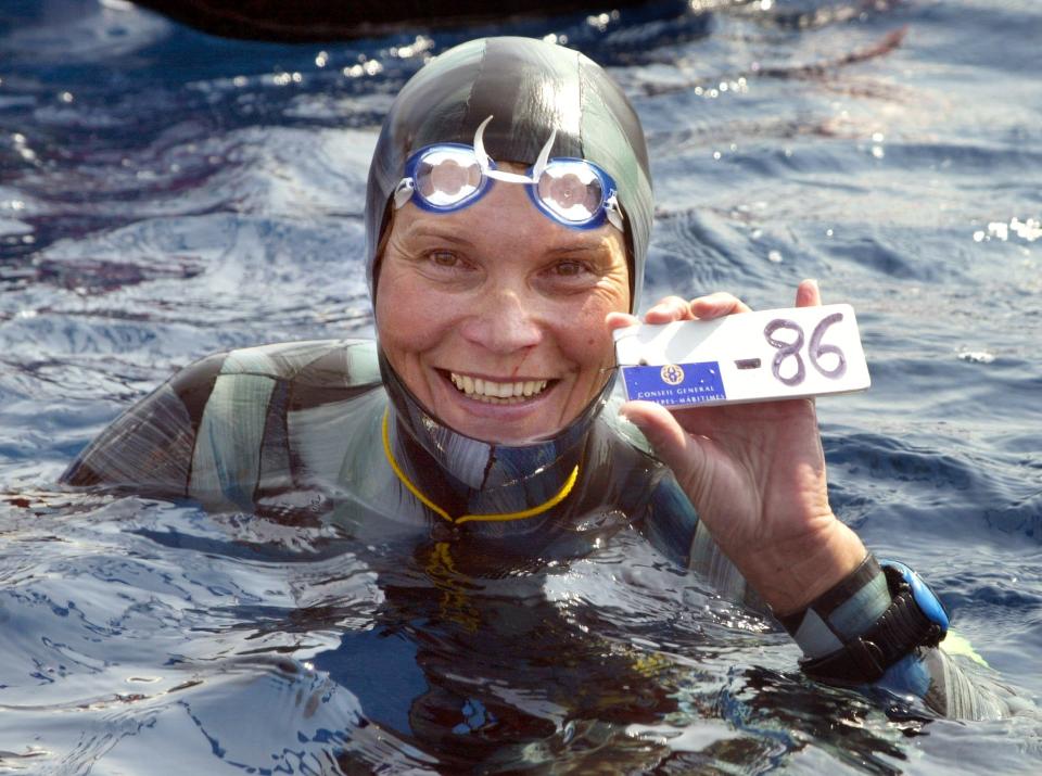 A file photo taken on September 3, 2005 shows Russian Natalia Molchanova holding the minus 86 metres tag that gives her a win in the first women's free-diving world championship in Villefranche-sur-Mer, France. Molchanova, 53, has been missing since August 2, 2015 following a dive off the coast of Formentera in Spain.
