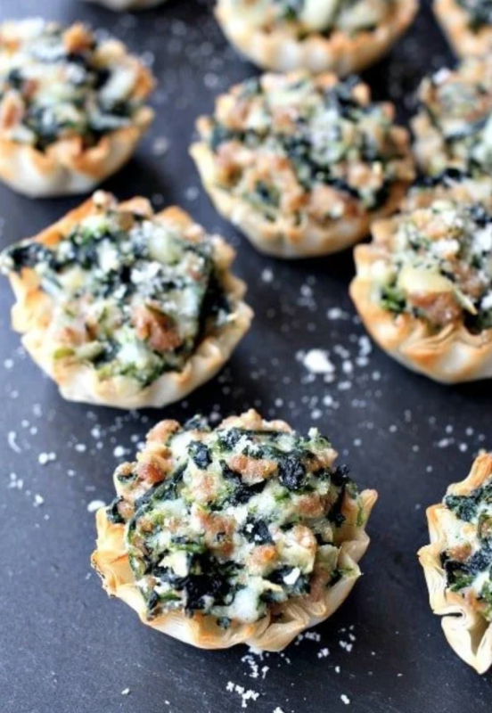<p>Mantitlement</p><p>These spinach and sausage phyllo cups are loaded with spinach, sausage and three different kinds of cheese. They’re the best way to serve spinach if you ask me!</p><p><strong>Get the recipe: <a href="https://www.mantitlement.com/spinach-and-sausage-phyllo-cups/" rel="nofollow noopener" target="_blank" data-ylk="slk:Spinach and Sausage Phyllo Cups;elm:context_link;itc:0;sec:content-canvas" class="link "><em>Spinach and Sausage Phyllo Cups</em></a></strong></p>