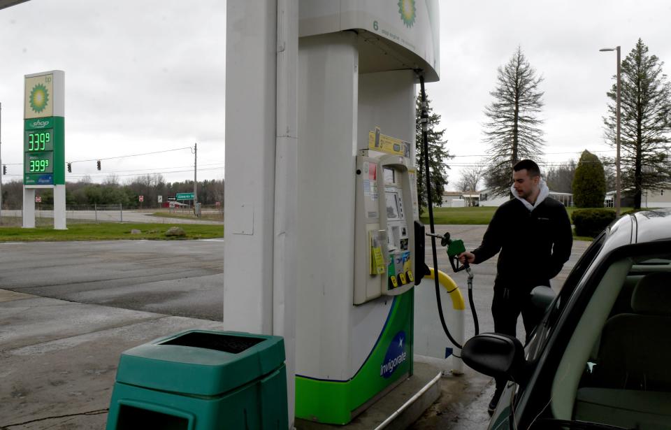 Nathan Davis of Doylestown puts gas in his car at Doylestown Food Mart located at the intersection of state Route 21 and Edwards Road in Doylestown. He said it is his regular gas station because of low prices. He's unsure how upcoming improvements to Route 21 may interfere with his travel.