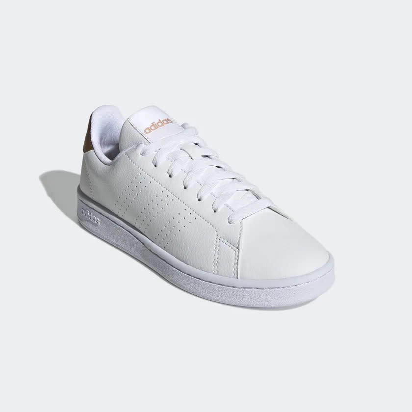 White sneakers with perforated upper.