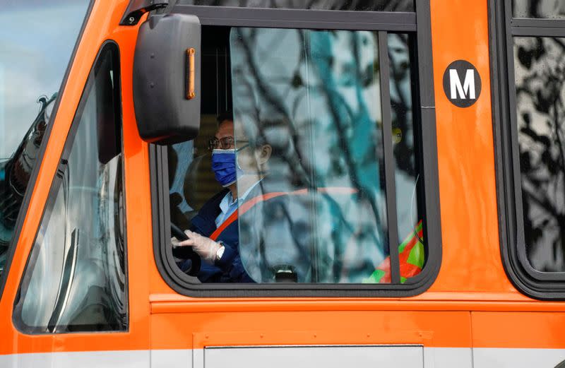 Los Angeles Metro bus drivers wear protective masks while working during the outbreak of the coronavirus disease (COVID-19) in Los Angeles, California