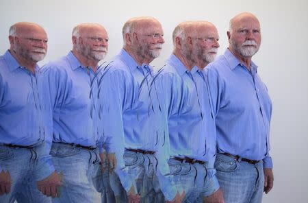 Genetic researcher Craig Venter is shown with a multiple camera exposure in his office in La Jolla, California March 7, 2014. REUTERS/Mike Blake