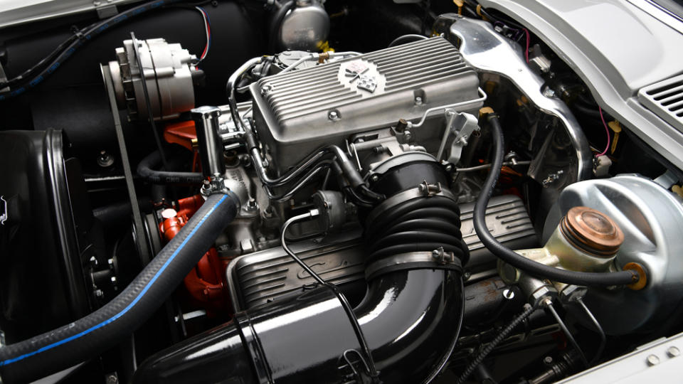 A fuel-injected 327 ci V-8 engine gives the ‘Vette 360 hp. - Credit: Barrett-Jackson