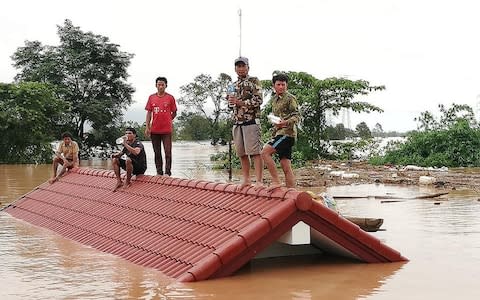 A photo posted by Attapeu Today's Facebook page showing people stuck in flooded villages after a Laos dam collapse - Credit: Attapeu Today