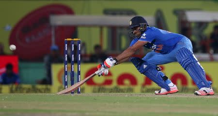 Rohit Sharma prepares to play a shot during their first Twenty-20 cricket match against South Africa in Dharamsala, October 2, 2015. REUTERS/Adnan Abidi