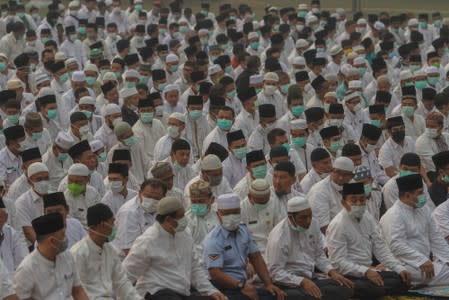 Indonesian Muslims gather as they pray for rain during a long drought season and haze in Pekanbaru