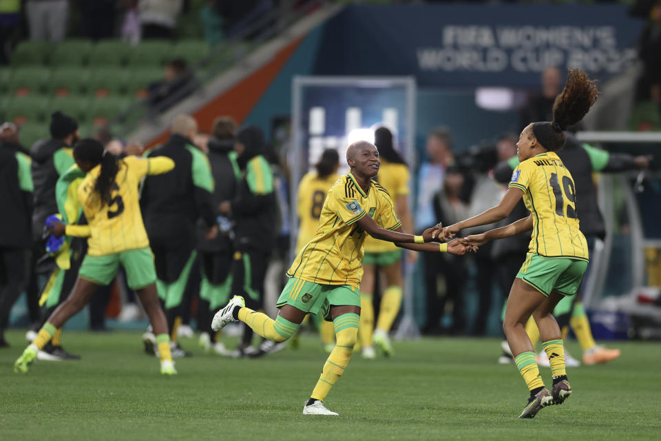 Jamaica's Deneisha Blackwood and Jamaica's Tiernny Wiltshire celebrate after drawing a 0-0 tie during the Women's World Cup Group F soccer match between Jamaica and Brazil in Melbourne, Australia, Wednesday, Aug. 2, 2023. (AP Photo/Victoria Adkins)