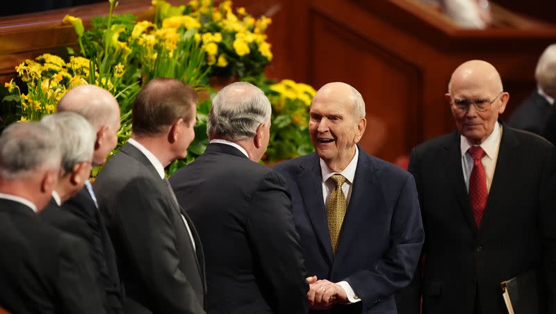 President Russell M. Nelson, president of The Church of Jesus Christ of Latter-day Saints, greets Elder Ronald A. Rasband, of the Quorum of the Twelve Apostles, in the Conference Center in Salt Lake City before the Sunday afternoon session of the 193rd Annual General Conference on April 2, 2023.