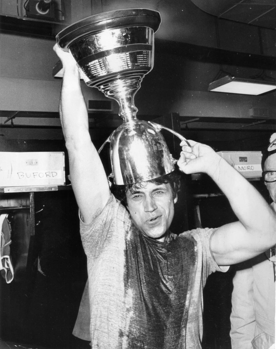 Ottawa Rough Riders' John Kruspe uses the Grey Cup as a party hat after defeating the Edmonton Eskimos 22-18 at Exhibition Stadium in Toronto in 1973. (The Globe and Mail/The Canadian Press)