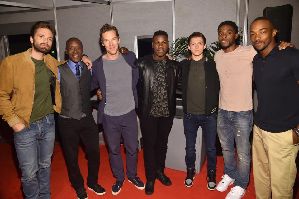 <p>Super fanboy John Boyega (center) couldn’t resist meeting Marvel heroes Sebastian Stan (Winter Soldier), Don Cheadle (War Machine), Benedict Cumberbatch (Dr. Strange), Tom Holland (Spider-Man), Chadwick Boseman (Black Panther), and Anthony Mackie (Falcon). (Photo: Getty Images for Disney) </p>