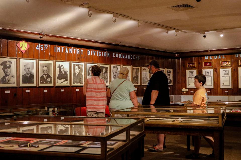 Mark Moberly and his family explore the Medal of Honor room in the the 45th Infantry Division Museum on June 21.