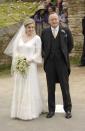 <p>Parker Bowles chose a v-neck gown with bell sleeves and floral details for her wedding to Harry Lopes.</p>