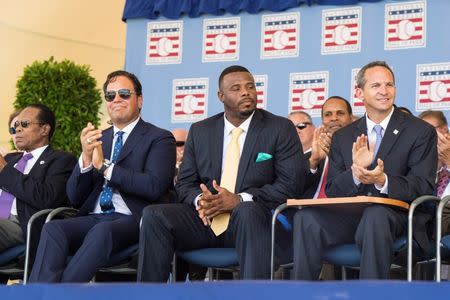 Jul 24, 2016; Cooperstown, NY, USA; Hall of Fame Inductee Mike Piazza and Hall of Fame Inductee Ken Griffey Jr. and Hall of Fame President Jeff Idelson clap during the 2016 MLB baseball hall of fame induction ceremony at Clark Sports Center. Mandatory Credit: Gregory J. Fisher-USA TODAY Sports