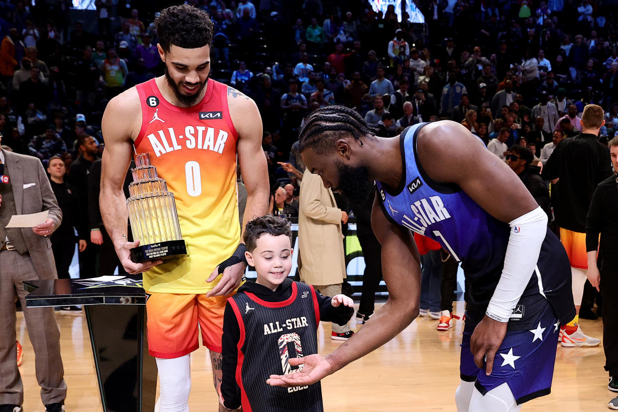 Boston Celtics star Jaylen Brown greets Deuce Tatum, whose father Jayson won the NBA All-Star Game's Kobe Bryant MVP Award after scoring a record 55 points. (Tim Nwachukwu/Getty Images)