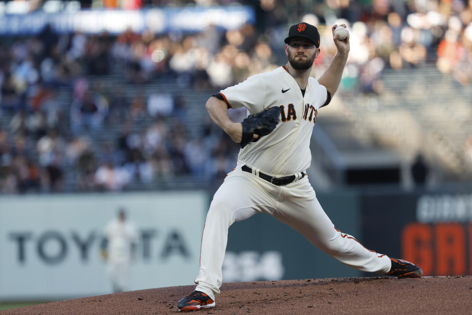 San Francisco Giants starting pitcher Alex Wood throws against the Kansas City Royals in the first inning of a baseball game in San Francisco, Monday, June 13, 2022. (AP Photo/Josie Lepe)