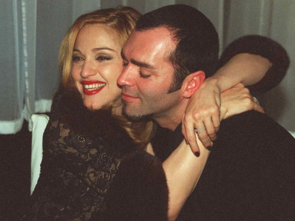 <p>Gary Friedman/Los Angeles Times/Getty</p> Madonna and Christopher Ciccone after the Golden Globes in 1997 