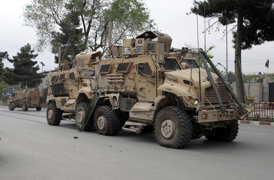 In this May 3 , 2017 file photo, A damaged U.S. military vehicle is pictured at the site of a suicide attack in Kabul, Afghanistan. In an "open letter" to U.S. President Donald Trump, Afghanistan's Taliban on Tuesday reiterated their call for a withdrawal of troops to end the protracted war.