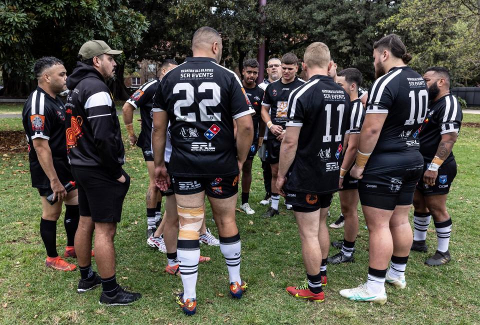 <span>The Redfern All Blacks A-Reserve team warm-up ahead of their grand final on Sunday.</span><span>Photograph: Jessica Hromas/The Guardian</span>