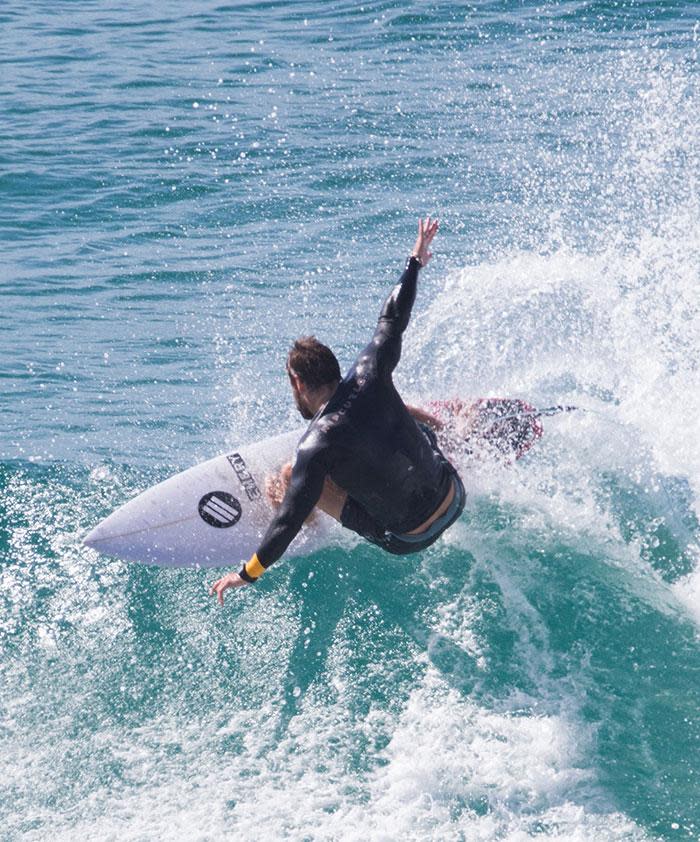 These Hot Photos Of Chris Hemsworth Surfing Will Make Your Friday