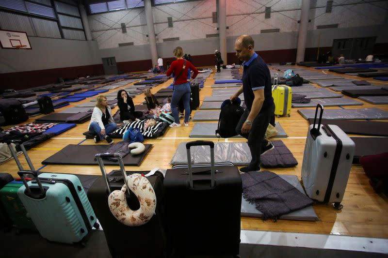 Ukrainians who fled to Mexico amid Russia's invasion of their homeland, arrive at a shelter to wait to enter into the United States near the border between Mexico and U.S., in Tijuana