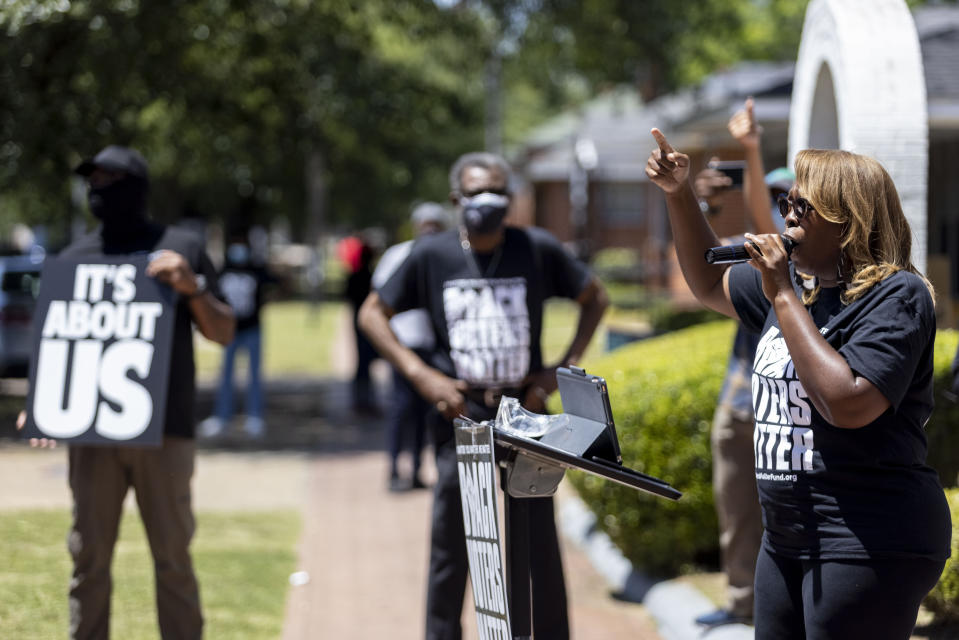 LaTosha Brown, co-founder of Black Voters Matter, speaks on voting rights at the John Lewis Advancement Act Day of Action, a voter education and engagement event, Saturday, May 8, 2021, in front of Brown Chapel A.M.E. Church in Selma, Ala. Black Voters Matter co-founders LaTosha Brown and Cliff Albright aim to increase the political power of Black communities. Last year, Brown says the group's two channels distributed about $10 million to 600 local organizations across 15 states. (AP Photo/Vasha Hunt)