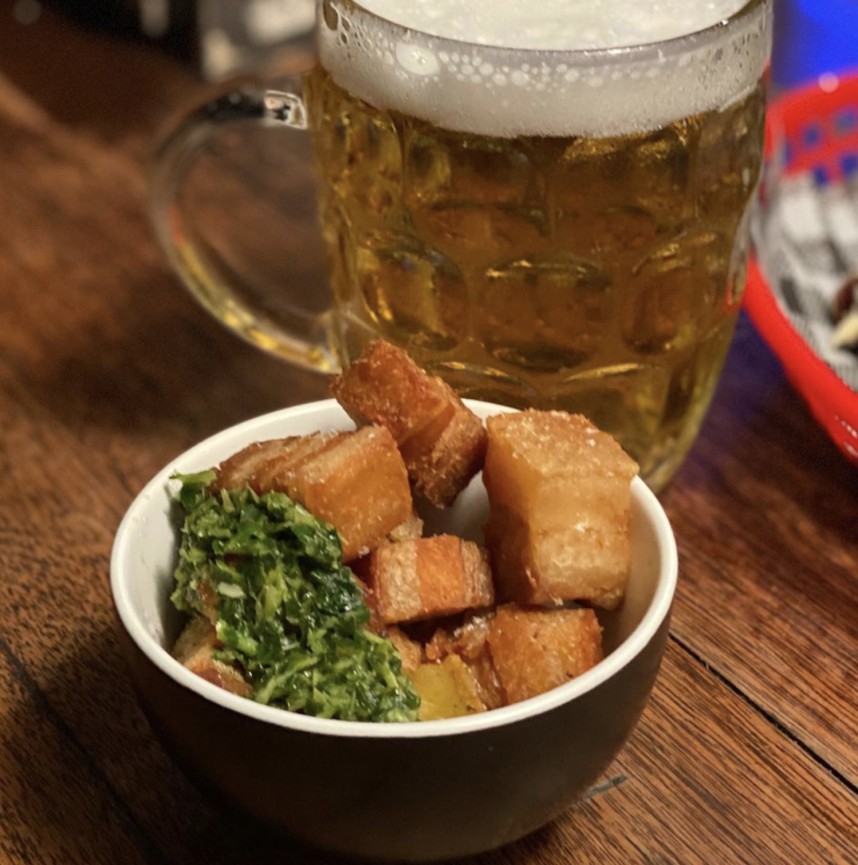 The Pork belly crackling with salsa and a stein of beer at Brisbane’s Fat Angel Sports Bar and Grill