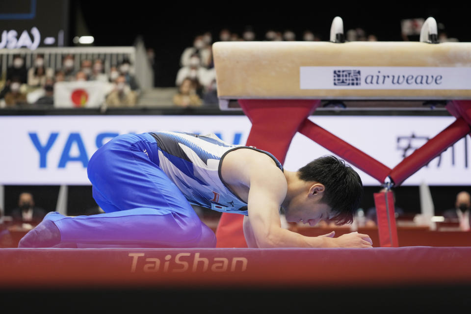 Daiki Hashimoto, of Japan, reacts after falling in the pommel horse during the men's all-around finals in the FIG Artistic Gymnastics World Championships in Kitakyushu, western Japan, Friday, Oct. 22, 2021. (AP Photo/Hiro Komae)