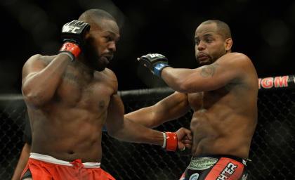 Jon Jones punches Daniel Cormier during their UFC 182 fight. (USAT)