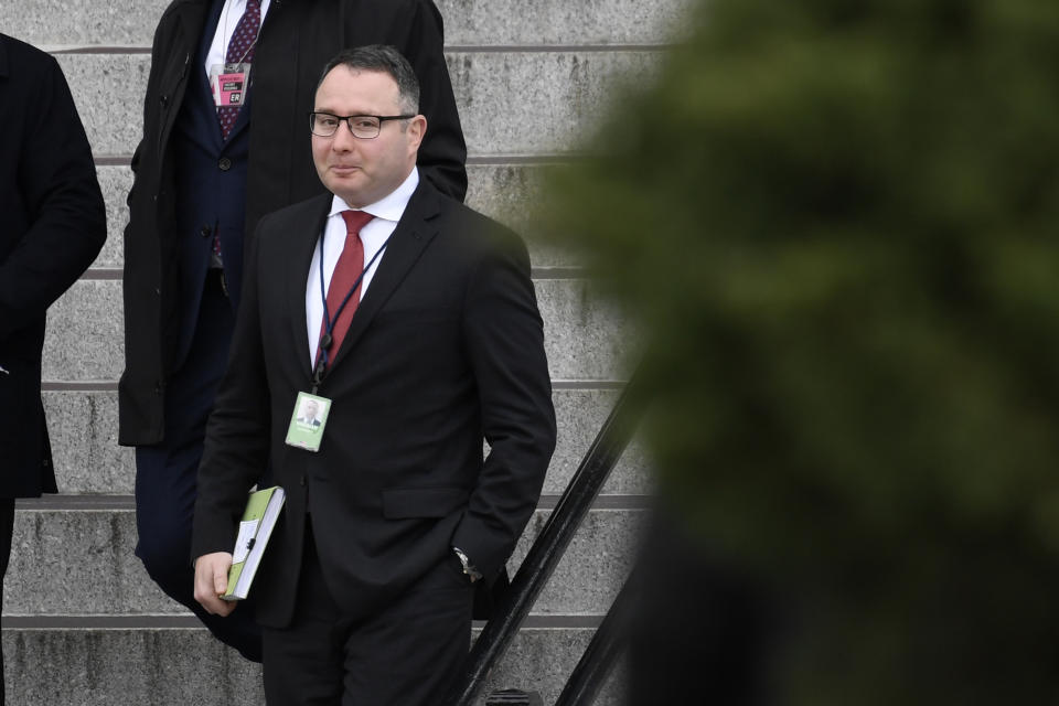 Army Lieutenant Colonel Alexander Vindman, a military officer at the National Security Council who testified during the impeachment hearings on Capitol Hill, walks down the steps of the Eisenhower Executive Office Building on the White House complex in Washington, Monday, Jan. 27, 2020. (AP Photo/Susan Walsh)