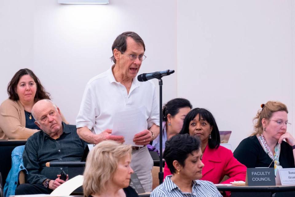 UNC history professor Harry Watson reads his resolution regarding a new school proposal during the UNC Faculty Council meeting held in at the Gillings School of Global Public Health on the campus of the University of North Carolina at Chapel Hill. February 17, 2023.